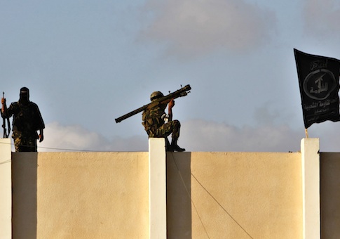 A Palestinian militant from the al-Nasser Brigades, an armed wing of the Popular Resistance Committees (PRC), holds a shoulder missile launcher in Gaza City