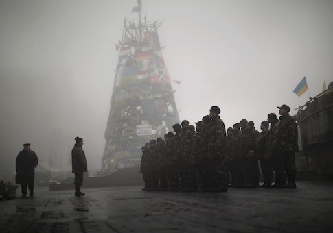 Ukrainian recruits receive instructions from a commander in a recruitment self defense quarter at Kiev's Independence Square, Ukraine