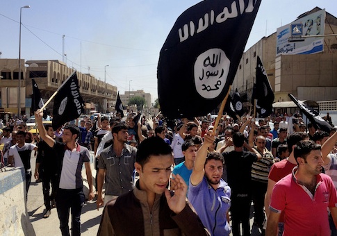Demonstrators chant pro-al Qaeda-inspired Islamic State of Iraq and the Levant as they carry al Qaeda flags in front of the provincial government headquarters in Mosul