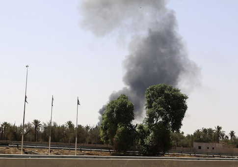 Smoke rises over the Airport Road area after heavy fighting between rival militias broke out near the airport in Tripoli