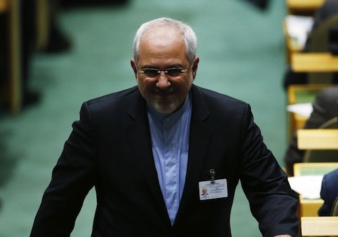 Iranian Foreign Minister Mohammad Javad Zarif walks down an aisle at the 69th United Nations General Assembly in New York