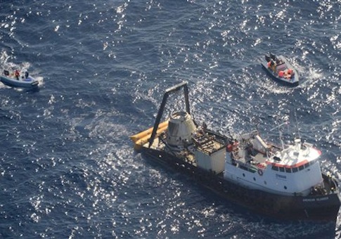 This photo provided by SpaceX shows an unmanned Dragon freighter that left the International Space Station with a stash of precious medical samples and aimed for a Pacific splashdown to end the first official shipment under a billion-dollar contract with NASA