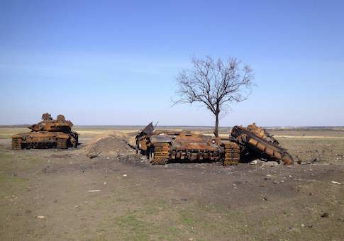 Two destroyed T-72 tanks, which presumably came from Russia, are seen on a battlefield near separatist-controlled Starobesheve in eastern Ukraine October 2