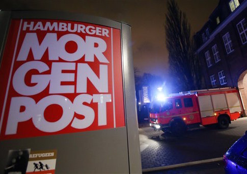 A firef truck sits outside the building of the 'Hamburger Morgenpost'