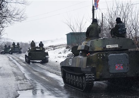 A pro-Russian armored vehicle moves toward Slovyanoserbsk, eastern Ukraine, Wednesday, Jan. 21, 2015