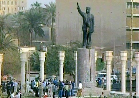 A rope hangs around the neck of a statue of Saddam Hussein, seen in this image from video, Wednesday, April 9, 2003, in Baghdad. Iraqis tied the rope onto the statue in an effort to pull it down