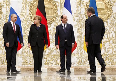 From the left : Russian President Vladimir Putin, German Chancellor Angela Merkel, French President Francois Hollande, and Ukrainian President Petro Poroshenko arrive to pose for a photo during a time-break in their peace talks in Minsk, Belarus