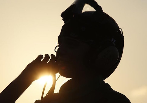 A flight deck personnel stands onboard the USS Theodore Roosevelt aircraft carrier in the Arabian Sea