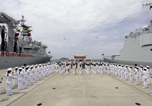 Chinese navy sailors stand in formation as they attend a send-off ceremony before departing for the Rim of the Pacific exercise, at a military port in Sanya