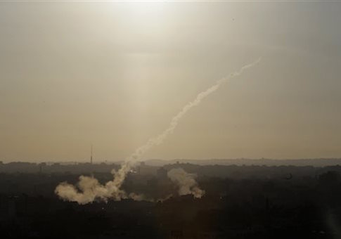 In this Aug. 9, 2014 file photo, a rocket is fired from Gaza City towards Israel