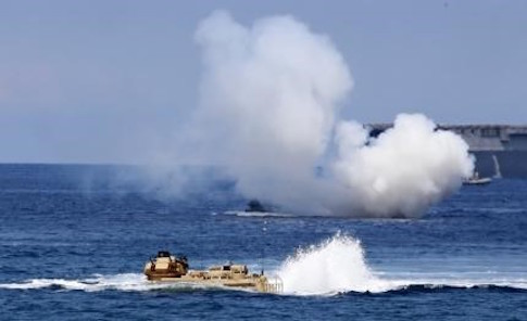 U.S. military forces aboard Amphibious Assault Vehicles (AAV) manuevre on South China Sea near the shore of San Antonio, Zambales during the annual "Balikatan" (shoulder-to-shoulder) war games with Filipino soldiers