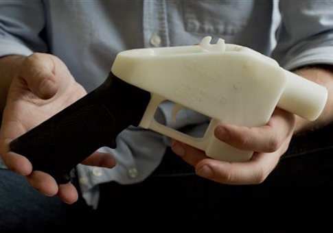 This photo taken May 10, 2013 shows Cody Wilson holding what he calls a Liberator pistol