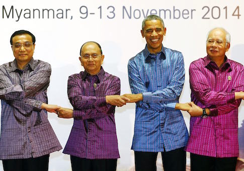 File photo of Asian leaders joining hands as they pose at the 25th Association of Southeast Asian Nations summit in Naypyitaw