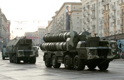 Russian military vehicles move along a central street during a rehearsal for a military parade in Moscow