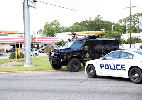 Police officers block off a road after a shooting of police in Baton Rouge