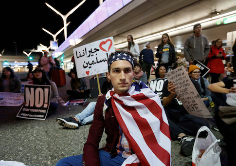 Demonstrators shut down the traffic loops at LAX International Airport and yell slogans during a protest against the travel ban imposed by U.S. President Donald Trump's executive order, at Los Angeles International Airport in Los Angeles
