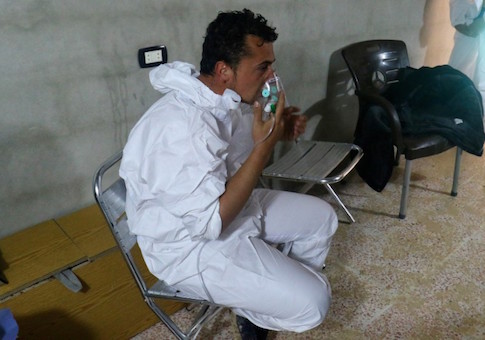 A man breathes through an oxygen mask, after what rescue workers described as a suspected gas attack in the town of Khan Sheikhoun in rebel-held Idlib