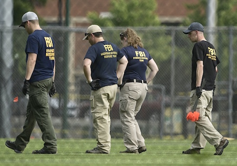 FBI and other law enforcement officials inspect a crime sceneFBI and other law enforcement officials inspect a crime scene