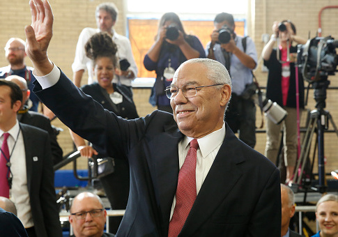 Former US Secretary of State Colin Powell waves before arrival of President Barack Obama at Benjamin Banneker Academic High School in Washington,DC on October 17, 2016. / Getty Images