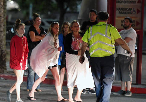 LAS VEGAS, NV - OCTOBER 02: People are directed to rides outside the Thomas & Mack Center after a mass shooting at a country music festival on October 2, 2017 in Las Vegas, Nevada. People who could not go to hotel-casinos that were closed after the shooting are temporarily staying at the center. The gunman, identified as Stephen Paddock, 64, of Mesquite, Nevada, allegedly opened fire from the Mandalay Bay Resort and Casino on the music festival, leaving at least 50 people dead and hundreds injured. Police have confirmed that one suspect has been shot. The investigation is ongoing. (Photo by Ethan Miller/Getty Images)