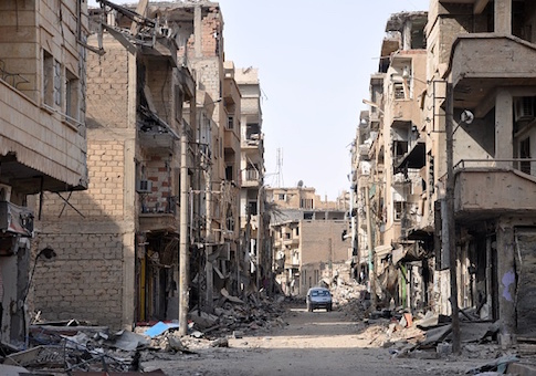A general view shows damaged buildings in the eastern Syrian city of Deir Ezzor where Syrian and allied forces converged on holdout ISIS fighters