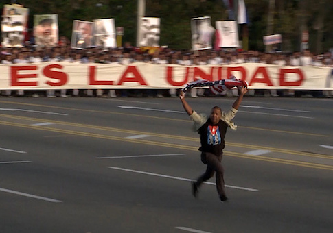 Video grab showing a man who burst in front of the May Day march waving a U.S. flag, at Revolution Square in Havana / Getty Images
