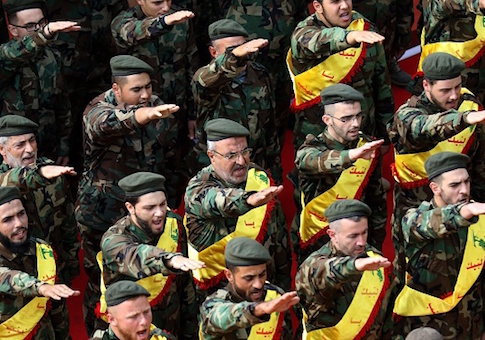 Members of Lebanon's Shiite Hezbollah movement salute