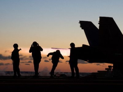 An F/A-18 Hornet takes off from the deck of the USS George H.W. Bush in the Atlantic ocean