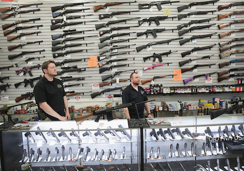Guns built by DSA Inc and other manufacturers are displayed inside the DSA Inc. store