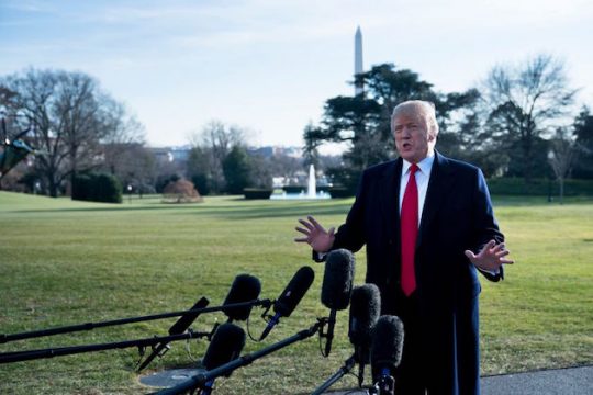 President Donald Trump talks to the press