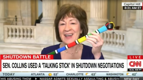 Susan Collins shows off 'talking stick'