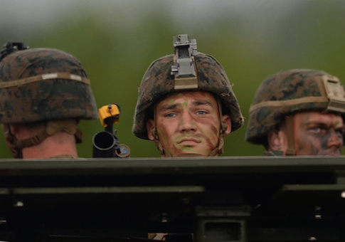 US marines ride on an Amphibious Assault vehicle during a beach landing exercise at a naval training base