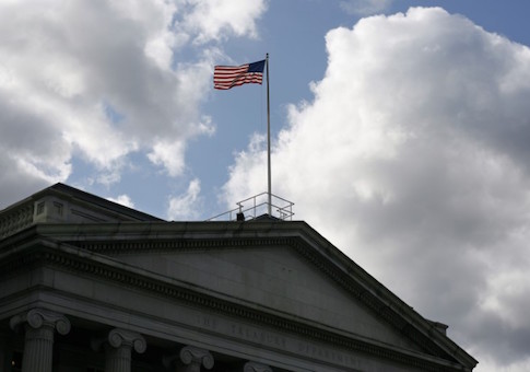 The United States flag flies atop the U.S. Treasury Department in Washington