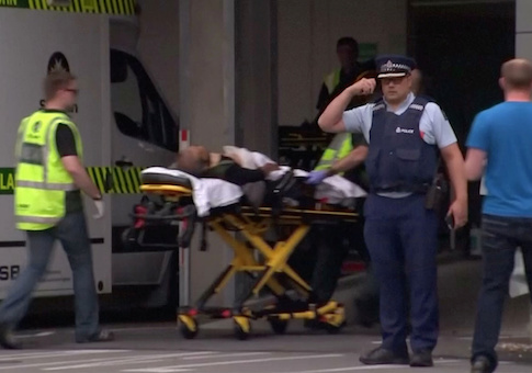 Video grab of emergency services personnel transport a stretcher carrying a person at a hospital, after reports that several shots had been fired, in central Christchurch