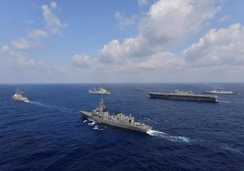 Vessels from the U.S. Navy, Indian Navy, Japan Maritime Self-Defense Force and the Philippine Navy sail in formation at sea