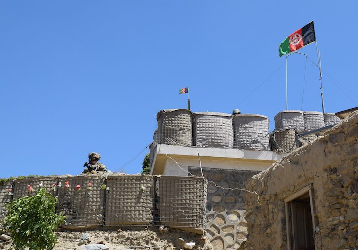 An advisor from the 2nd Security Force Assistance Brigade stands at the fortification of a base during deployment to Afghanistan