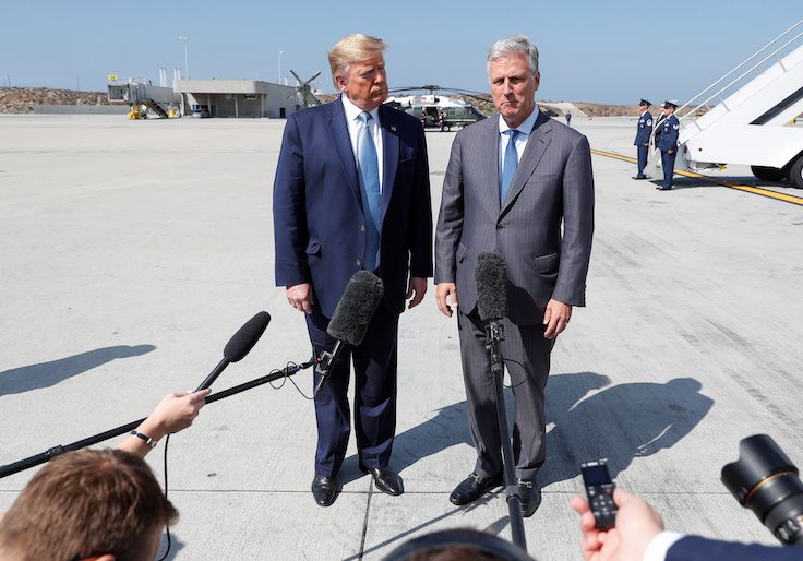 U.S. President Donald Trump faces reporters with U.S. hostage negotiator Robert O'Brien