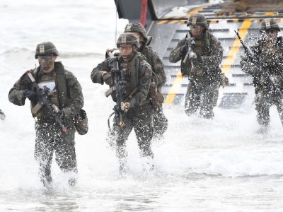 U.S Marines can be seen disembarking form a landing craft as part of an amphibious landing on July 22, 2019 in Bowen, Australia