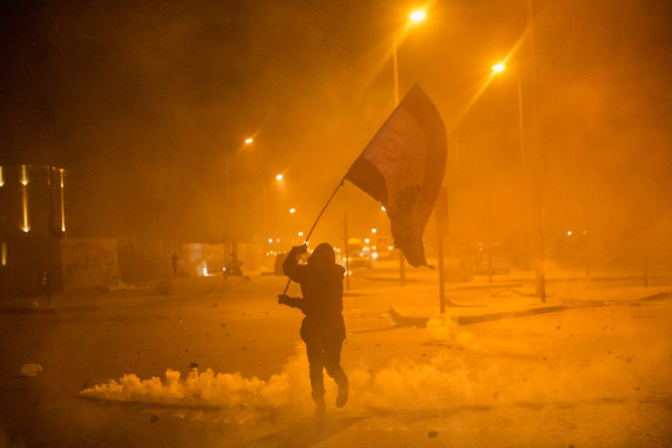 Anti-government protesters and riot police clash during a second day of violence, on January 22, 2020 in Beirut, Lebanon