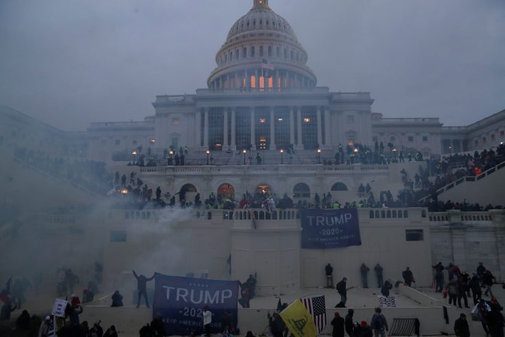 Police officers stand guard as supporters of U.S. President Donald Trump gather in front of the U.S. Capitol building
