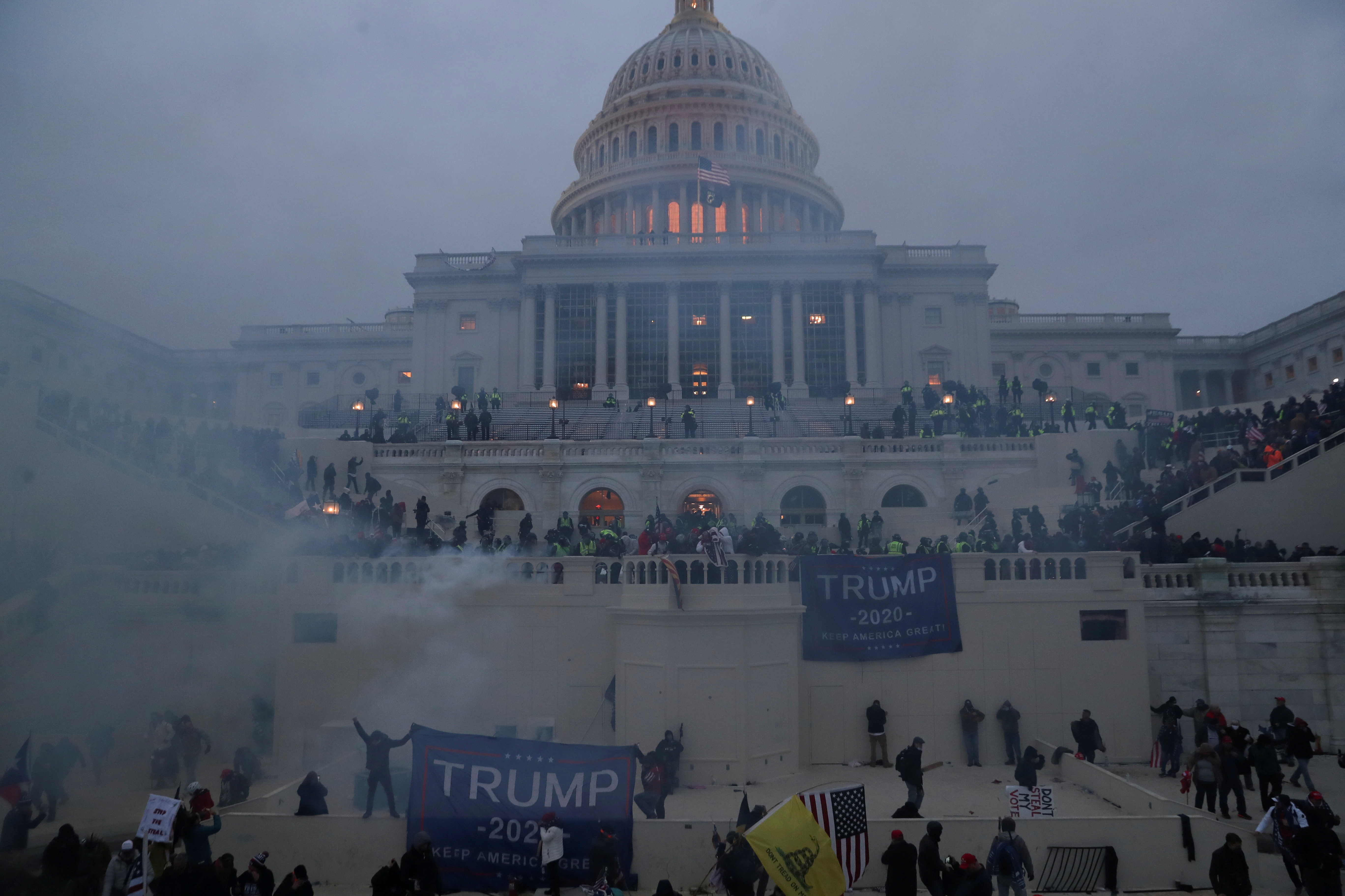 Police officers stand guard as supporters of U.S. President Donald Trump gather in front of the U.S. Capitol building