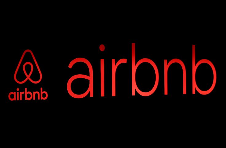 FILE PHOTO: The logos of Airbnb are displayed at an Airbnb event in Tokyo