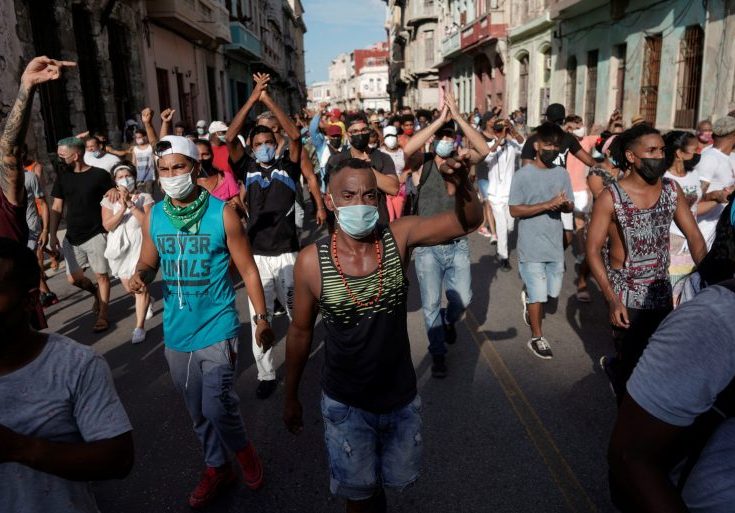 People shout slogans against the government during a protest in Havana